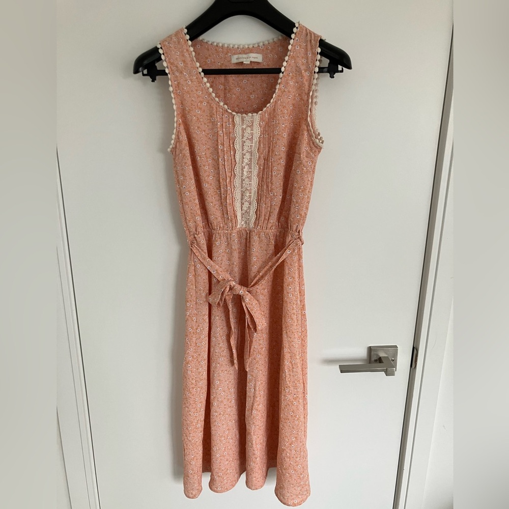 Orange dress with sash.